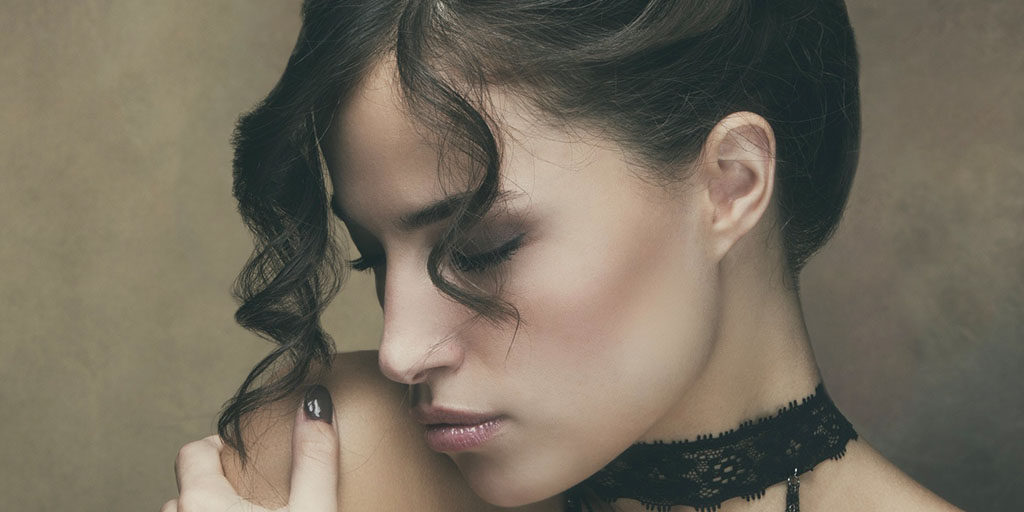 Stock portrait of woman showing retouched hair